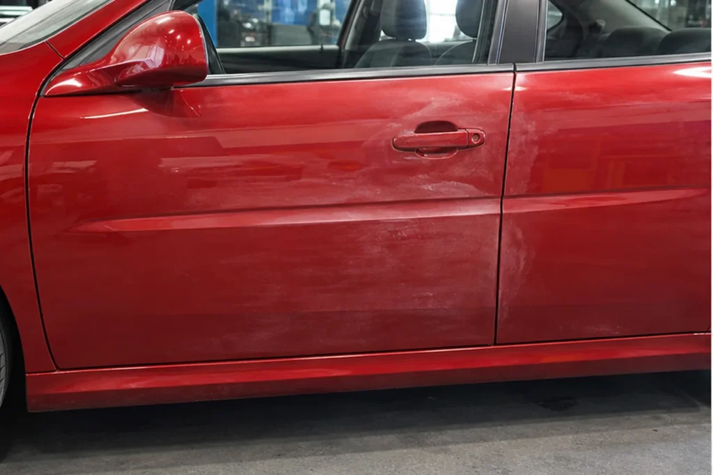 Red Door Paint Refinishing, before repair